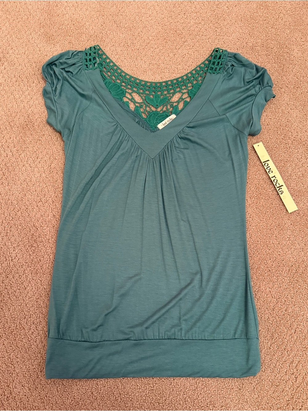 New with tag. Women’s top. Size large